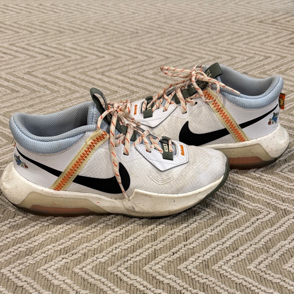 Nike White and Black Athletic Shoes with Orange Details